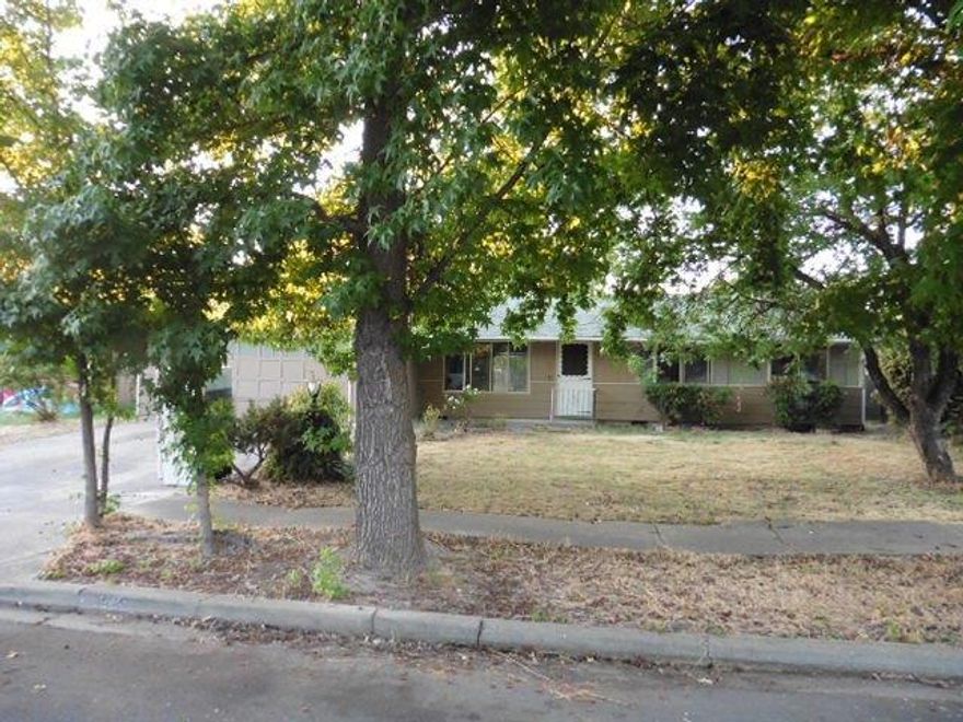 Lots of potential and offers 4 bedrooms, 2 living rooms and a large, fenced back yard. Open floor plan offers wood floors. Outside offers a covered patio and a 2 car attached garage.