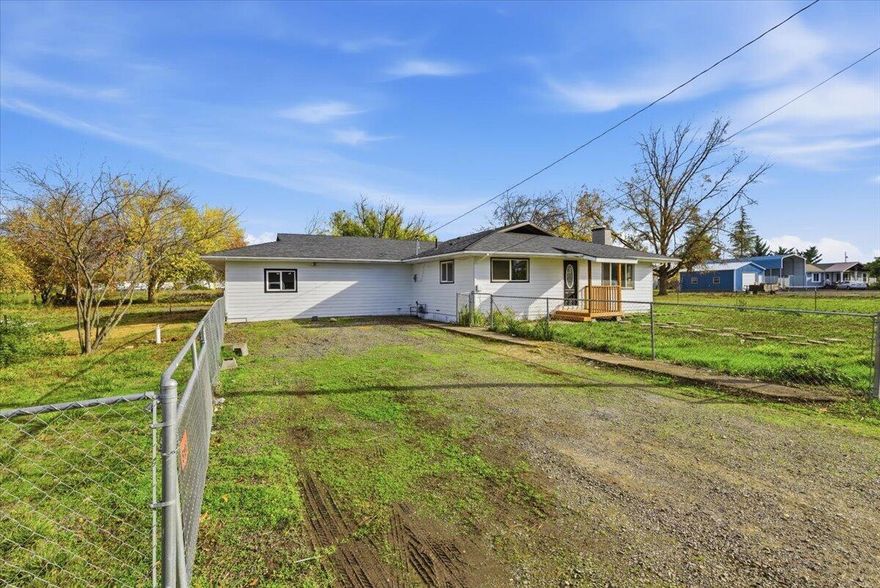 Country living close to Town! The perfect blend of country charm and modern comfort with this unique property. Set on 2.5 fully fenced, usable acres with open views this beautifully updated home offers space, style, and flexibility for today's lifestyle. This 1,632 sq ft home offers 2 bedroom, 2-bath home plus office and you'll find thoughtful updates throughout. The attached garage has been converted into an additional 2 bedrooms and 1 bath, ideal for guests, extended family, or a private workspace. New front porch, updated kitchen with new granite countertops and modern finishes, bathrooms fully renovated, New laminate flooring throughout, New interior and exterior paint, updated light fixtures adding warmth and style, Natural gas hookups for convenience and efficiency. Outside, enjoy the best of country living  plenty of space for animals, gardening, or future expansion