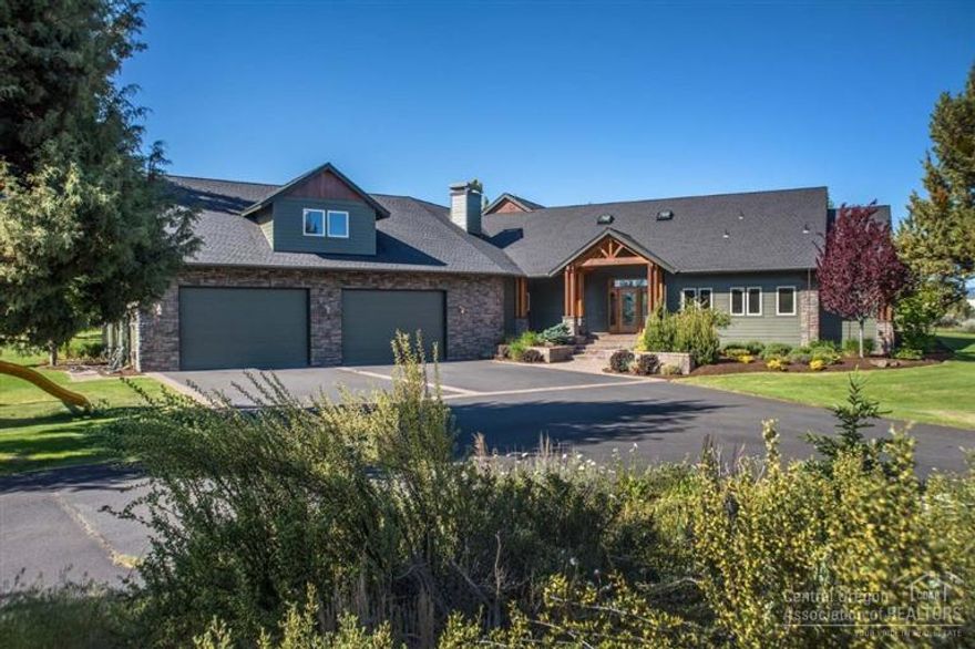 Enjoy your own private paradise in NE Bend. Cascade Mtn Views on nearly 3 acres of gently rolling grounds, expansive lawns & natural landscape. NW style custom home w/stone & timber accents, paver patios & covered outdoor living. Inside you'll discover architectural beauty w/soaring vaults framed by graceful arches, a sweeping spiral staircase & floor to ceiling wndws. Entertainer's kitchen, bar & family rms. Master Suite w/spa style bath & steam shower, heated Travertine flrs. Pool & Pull thru RV Garage!