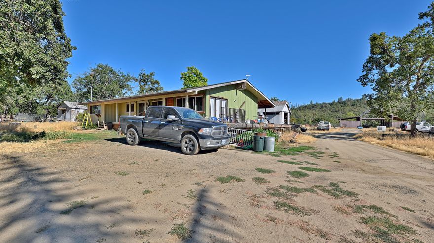 27 Acres of Country Living with Endless Possibilities!
Welcome to your dream horse property—over 27 acres of beautiful, flat, fenced land with irrigation rights! This one-of-a-kind property offers two residences: a spacious 4-bedroom, 2-bath main home and a single-wide mobile home with thoughtful add-ons—perfect for extended family, rental income, or guest quarters.
As you enter through the gated driveway, you'll be greeted by the peaceful charm of the countryside—watch the birds follow you up the drive to your new home. The property is set up with multiple workshop areas, making it ideal for hobbyists, entrepreneurs, or anyone needing extra space for projects.
Bring your horses, livestock, and vision—this property offers endless potential. With a little TLC to the homes, you can create the ultimate country retreat where you can live, work, and play all in one place.