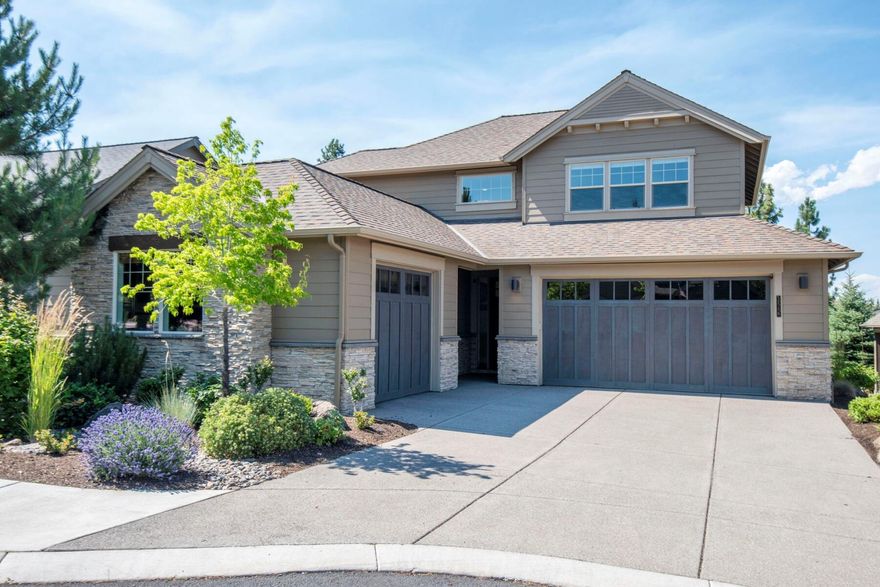 This immaculate home located next to common area & on the golf course in Rivers Edge, is minutes from the desirable Deschutes River Trail & Downtown, providing an easy commute to all that Central Oregon has to offer. The open floor plan features 9-ft ceilings, 8-ft doors, an office, elegant cabinets, & beautiful hrdwd flrs, that enhance the main living areas. Walls of windows fill the space w/ abundant natural light. A spacious chef's kitchen is equipped w/stainless steel appliances & a lg walk-in pantry. The expansive kitchen island, featuring quartz countertops, opens seamlessly to the great rm, creating an ideal space for entertaining. An elegant floor-to-ceiling stacked stone fireplace provides a cozy retreat. The generous main-level primary suite boasts coffered ceilings, a soaking tub, a tiled walk-in shower, a double vanity, & a lg walk-in closet. This thoughtfully designed floor plan offers excellent separation between 2 additional bdrms & family rm. A 3 car garage & mtn views