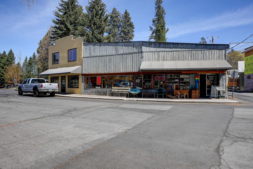 This iconic 7,480 sf mixed-use building located in the Opportunity Zone boasts two ground-level commercial spaces totaling approximately 6,000 sf and two separate fully renovated high-end residential units. Sought-after Old Bend location minutes from the Old Mill, the downtown core, the Galveston corridor, and amenities such as the Whitewater Park, McKay Park, Drake Park, Box Factory and countless other hip and vibrant restaurants and shops. This is a very special and unique property in a prime location poised for re-development.