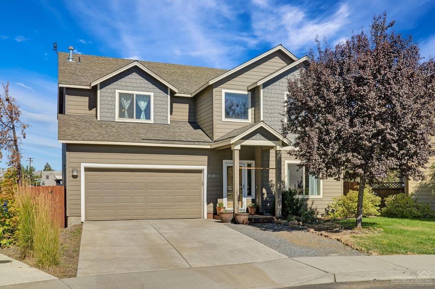 Spacious home with 4 bedrooms and flex space in a wonderful neighborhood in Northeast Bend! From the moment you step in to the two story open entry you will fall in love with this home! Charming updates throughout including the addition of barn door and french doors to formal living and dining area so that it can be used in multiple ways; whether as office, bonus room, extra flex space or formal living/dining! Sliding doors off the kitchen out to deck with big backyard and mountain views. Upstairs are four spacious bedrooms including vaulted ceiling master suite with soaking tub, french doors and huge walk in closet! Laundry room conveniently located on second floor near bedrooms. Fresh paint, new waterproof floors, lighting fixtures and amazing playhouse in backyard - this one has it all at a great price! Please see virtual tour for 3D walk through!