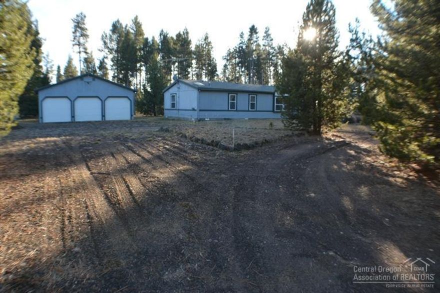 Come see this wonderful home, nestled on 1 acre, with great neighbors! This 1995 Fleetwood Stone Ridge Manufactured Home consists of 1560 sq. ft., 3 bedrooms, 2 baths with one large bonus room, an additional bonus room/ office and a mudroom. It's open and bright and feels very spacious. This home also features a huge 3 car garage with shop area and loft in the 3rd bay. This is a great value and a must see!