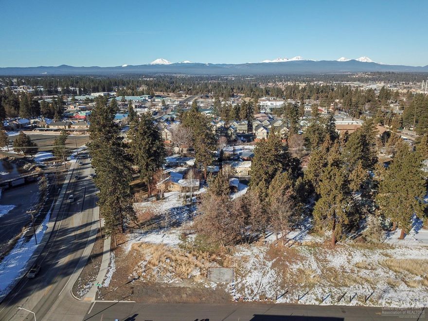 Per the City of Bend, zoned Residential Medium Density(RM)! The required lot depth of 50 feet just became effective 10/19/18. Buyer responsible for doing their own due diligence. Great development potential .94 acres on corner of Reed Market and 5th St in Bend. Main utilities are in 5th St. Desirable proximity near mostly newer homes with easy access across street to trail system, 2 blocks from restaurants and businesses. Minutes to Old Mill, town, fine dining, shops, theater, grocery stores, gym, Deschutes River, trail system, recreation, concerts, US 97 and more.