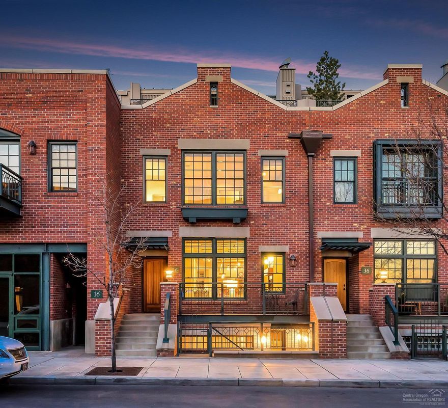 Mill Quarter is Bend's nationally recognized, urban brownstone-style community, built to commercial grade standards & winner of the COBA awards for green building. Tucked perfectly between Downtown & the Old Mill, the Central Oregon lifestyle is at your fingertips. With a live/work lower level office, two car garage, private elevator and roof top deck with sweeping mtn views, this property has it all. Home includes a transferable short term rental permit and is fully furnished. Modern living at it's finest.
