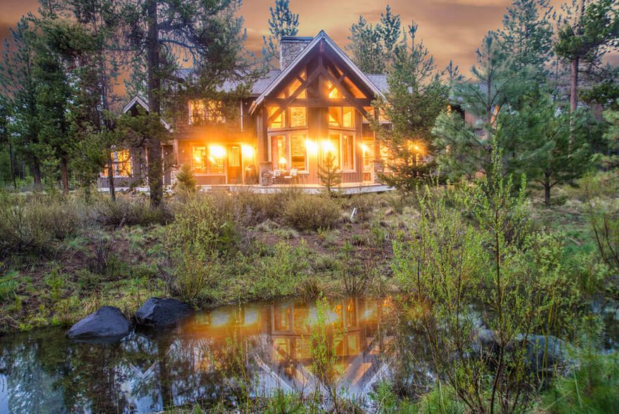 Welcome to 56457 Sunstone Loop. This stunning architecturally designed home is situated on one of the premier home sites in the established Phase I community of Caldera Springs. Surrounding common spaces give a sense of solitude and privacy. Paved trails out the back door lead to the close proximity of The Lakehouse, Quarry Pool and Fitness Facility. A natural stream, along the adjacent common area to this lot, gently meanders from Fireglass Lake across the street and can be enjoyed from the spacious South-West facing low maintenance deck with hot tub. Enter the large foyer to be awed with the spectacular Lodge style, floor to ceiling, natural rock, and open sided gas fireplace. Great room design boasts vaulted wood ceilings, custom beam work, floor to ceiling windows, wainscots, and wood floors. Chef style spacious kitchen. Two Main level Masters with bath ensuite. Game/media room with wet bar, and 2 more bedrooms upstairs. Three car garage with locked storage. Fully furnished.