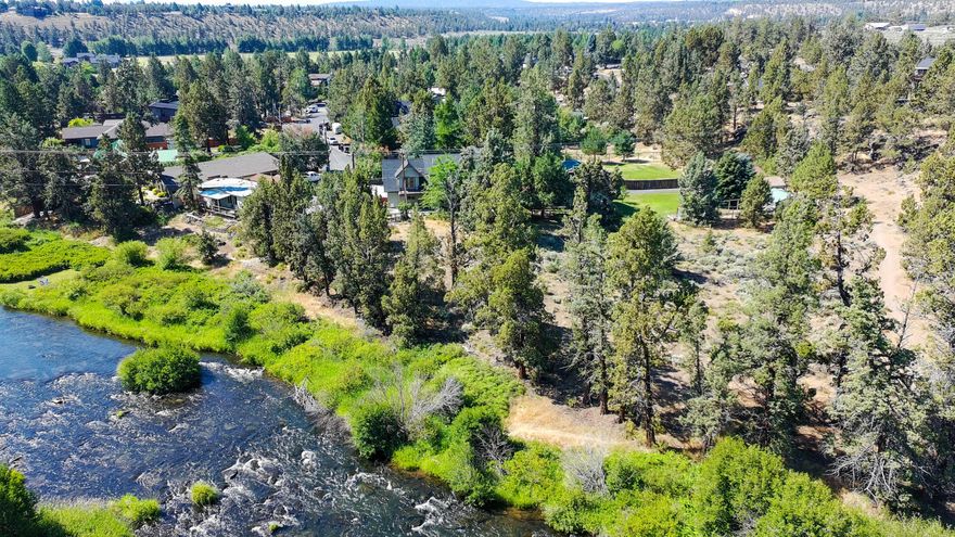 Enjoy end-of-road privacy & close proximity to the Deschutes River w/river views & access to 2 miles of river trail right outside your back door. Less than a mile to Tumalo School & minutes to downtown Tumalo, restaurants, pubs & food carts. Spacious updated home has been completely renovated including plumbing & wiring. Home features custom wood floors, solid wood doors & a tall, light-filled living space w/statement ceiling beam. Primary suite has its own large balcony, fireplace, walk-in closet w/built-ins & ensuite w/tile floors, soaking tub & separate shower. Large great room upstairs has storage & an additional balcony. Outside, find a powered greenhouse, heated/cooled shop, garden w/drip irrigation & water feature, fire pit, fruit trees & abundant wildlife. Shared irrigation water rights for subdivision. Additional perks include attached 2-car garage & numerous outbuildings. Rare Tumalo gem—privacy, views & location all in one! HOME COMPLETELY RENOVATED DOWN TO STUDS IN 2006.