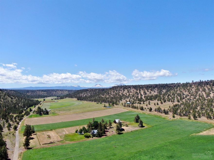 update 10/26/20:  CUP to build non-farm use dwelling now approved. 

Fertile, irrigated farm land. Excellent water rights. Total acreage 48.78 acres. Currently in grass hay production with pivot irrigation (23.5 total acres of irrigation rights), up to 3 cuttings with 5-6 ton per acre of grass hay. Hemp is grown well in the this canyon and surrounds as well as other crops and livestock.  
Faith, Hope, Charity Vineyard just down the road to the east. Banana belt of Central Oregon canyon. Pivot irrigation equipment included in sale of property. 

Other improvements made: Proposed home site that already has conduit and electrical vault in place.
Borders BLM on 2 sides. Canyon farm setting with view of Broken Top mountain. Wildlife abounds. Resident maintained gravel road.  
Private, yet easy access to Sisters & Redmond approx. 25 min. Picturesque wide open views to north/south canyon and then east towards Smith Rocks area.