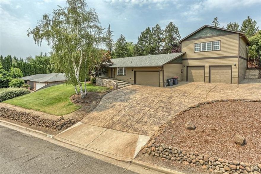 Endless possibilities in East Medford! This 3 bedroom, 2 bath home is one story living with an additional, private living space perfect for a mother-in-law set-up, office area, guest/nanny suite. Beautifully constructed with great window placement to enjoy the east hills, a spa-like bath and soaring vaulted ceilings. Gorgeous hardscape throughout the mature landscaping and abundant stamped concrete for lots of RV parking, off street parking and a fabulous inground pool concrete deck. .35 acre lot with a home that has recent updates of new vinyl windows, hardiplank siding, paint, marble floors and countertops, surround sound system and a speaker system throughout the home and patio area. Open kitchen, dining and family room. 4 car garage spaces, one commercially engineered. This property has a lot to offer!