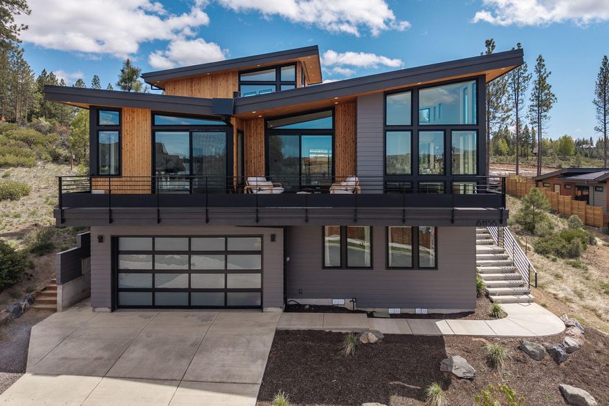 Experience luxury in this custom built 3 bed, 2.5 bath home with stunning Cascade Mountain views. French White Oak floors run throughout, complemented by dual zoned central air, and custom blinds. The great room offers a gas fireplace, while the kitchen features Quartz countertops and Stainless Steel appliances. The spa like primary bath includes heated floors, a soaking tub, and an app-controlled Swedish sauna. Custom shelving in bedroom closets and laundry, blackout shades, and stairway footlights add comfort and style. A versatile loft offers space for an office or play area. Additionally, this home includes a large laundry room and a dog bath. 

The extra deep heated garage includes a workbench, workout room with a TV, and a 1100CFM variable exhaust fan. Corian backsplash for the sink in the garage offers stain resistant convenience.
 
Enjoy the fenced and landscaped backyard with stylish sun sails, or the front patio with full mountain views, perfect for entertaining.