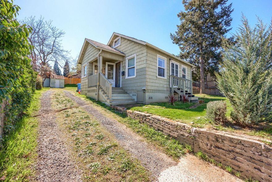 NEW ROOF AND PRICE ADJUSTMENT! Ashland charmer with so many opportunities! Close to downtown and Lithia Park. This home has beautiful hardwood floors, newer cheery interior paint, lots of windows letting in natural light and cute built-ins . One bedroom and one adorably appointed bathroom with an extra loft space that could be used for a play area, craft space, artist studio or storage. Nice sized R-2 lot. Home sits on the front of the lot and the backyard is open and expansive with potential to build an ADU. Fenced with a few fruit trees and views of the beautiful Ashland hills. Come see quickly - this one won't last!