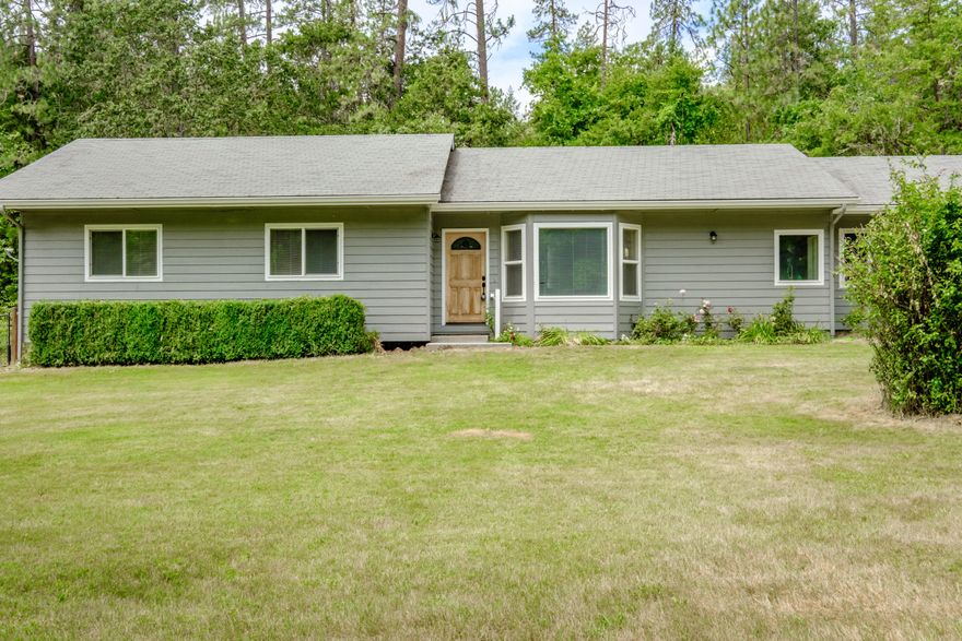 Merlin Gem!  Single-level Country home on one acre located in beautiful Southern Oregon just outside Grants Pass! Featuring a newly remodeled three bedroom, two bathroom home with attached double car garage and large fenced yard and underground sprinklers. Recent updates include: fresh paint inside & out, new carpet, flooring in bathrooms,  and modern light fixtures.  Neutral kitchen with new stainless steel appliances leads to dining space with hard wood floors and comfortable living room with vaulted ceilings.  Primary bedroom with walk-in closet & en-suite bathroom with walk-in shower. Two additional bedrooms and one guest bath.  Laundry room in garage with half bath and deep sink.  New roof to be installed by close of escrow!  Located in a quiet cul-de-sac neighborhood down a private drive.  Property backs up to BLM with daily wildlife sightings.  Close proximity to explore the Wild & Scenic section of the Rogue River! All this with low county taxes.