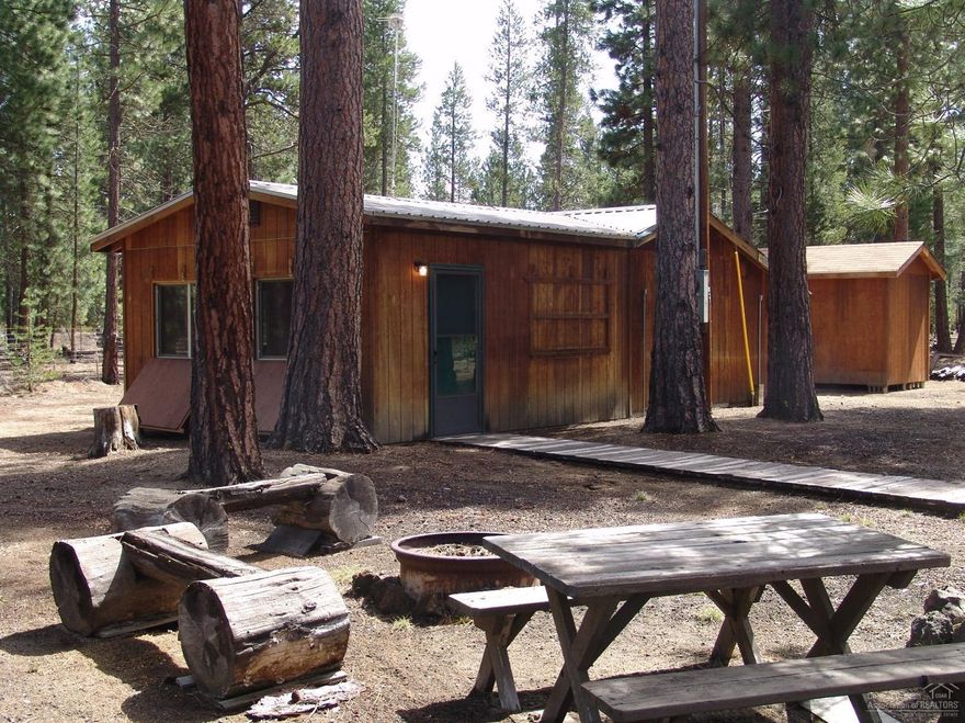 Looking for a Cabin in the woods? OR a Beautiful location to build? This 1/1 Cabin sits on 4.58 approx. acres + or -. This Cabin comes Fully Furnished and Ready to Enjoy!! Backs to BLM! You can ride your quad, horses, bikes, and hike right out the back of the property!! Would be great for anyone looking for a private spot, but not too far from town!!! Storage Shed included! Surrounded by Beautiful Trees, Close to Lakes, Fishing, Hiking, Biking, or Just to enjoy Nature! Don't Miss Out!!