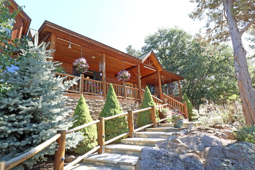 Warm wood tones surround you in this custom crafted  home.  Georgia yellow pine flooring, hickory distressed cabinets and Pella wood windows.   4 Bedrooms 3.5 baths. Large office and Murphy bed.