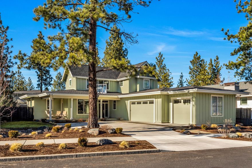 A beautiful, warmly inviting 3 bed + office farmhouse style home on quiet Celilo Ln. Located atop Bend's highly sought after Northwest Crossing, a stone's throw from Discovery Park and close to shopping, schools and trails. This two story home includes a private office, separate main level primary suite, upstairs bonus area, and three car garage with additional gear storage. The front entry leads to an open floor plan great room with built-in cabinets, hardwood floors, gas fireplace, kitchen with oversized island, Energy Star appliances, pantry and dining area that opens to an outdoor covered patio.  Primary suite on the main level offers a private bathroom with tiled floors and shower, soaking tub, solid surface double vanities and walk-in closet. Upstairs 2 bedrooms, full bathroom and bonus entertainment area create a dedicated space for guests or family.  Office is tucked away off the entry with an exterior door to the front covered porch and seating area.