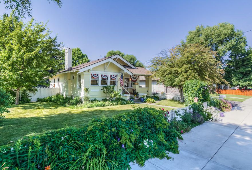 1920's Craftsman Bungalow Charmer!  Enjoy your huge front porch to sip your iced tea while being walking distance to many amenities. Nothing but character throughout, from your full entry bench, built-ins and nooks around every corner!  3 bed and bath on main level with another living space/bathroom plus flex that could be 4th bedroom, and bonus additional finished storage space. Private exterior door entrance to one bedroom would make a spectacular home office! Huge landscaped backyard, side garden area perfect for your own private escape.