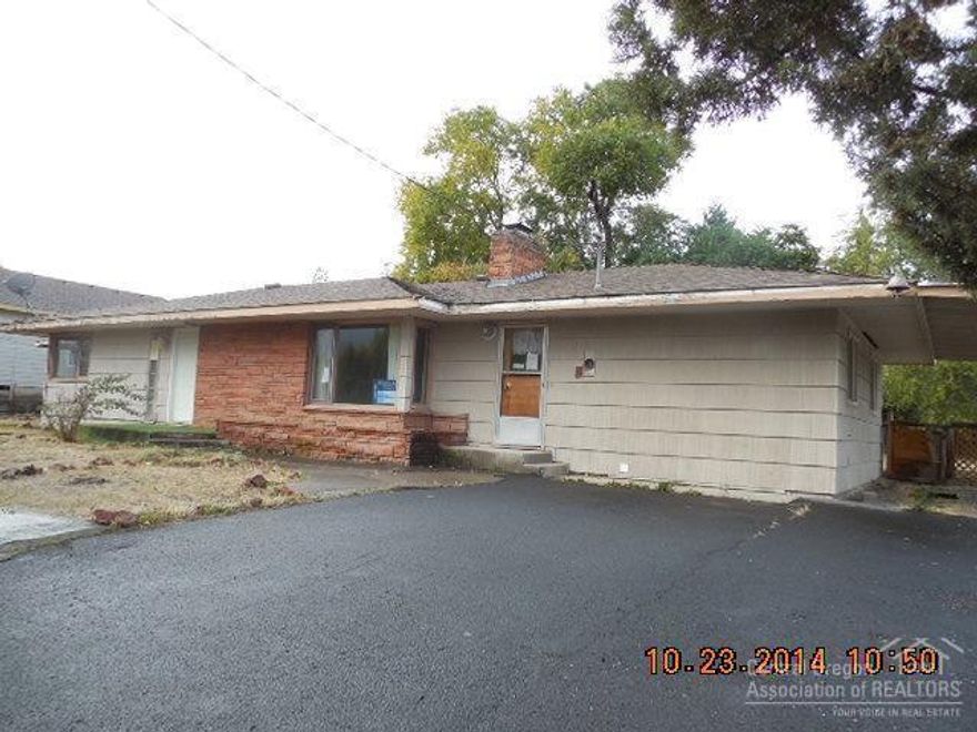 A great classic home in a wonderful Madras neighborhood waiting for you to make it whole again.