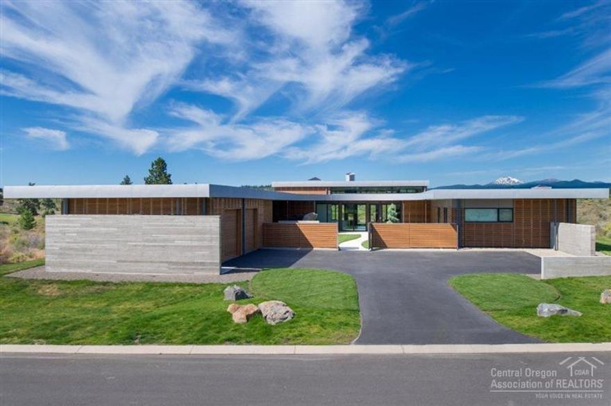 Contemporary masterpiece located in the thriving golf community of Tetherow. Stunning architecture is further enhanced by floor to ceiling windows & custom cedar siding. Expansive kitchen boasts clean lines & features custom made Pedini cabinets from Italy; central, open fireplace can be enjoyed from multiple rooms. Spacious floor plan includes large great room, bonus/fitness room, den/office plus four master suites, each with private baths. There is radiant heat flooring and a double attached garage.