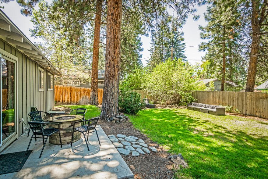 Embrace the balance of serene living and urban convenience of this classic mid-town Bend neighborhood.  This easy layout would work well for a family or use the guest bedrooms for home offices.   With fresh furnishings, hardwood floors, and abundant natural light this home is turn key ready.   Whether it's hosting barbeques, gardening, or simply savoring the tranquility, this spacious, fully fenced back yard offers endless possibilities for outdoor enjoyment including RV parking.    Close proximity to schools, pilot butte trails, coffee shops, and other mid-town convivences.  The sale could include all furnishings.