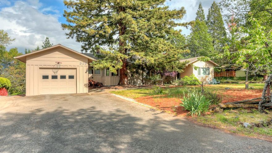 One of Ashland's best locations, Ridge Road offers a desirable quiet location above Lithia Park. This established older neighborhood offers all of the charm of Ashland with beautiful mountain views, mature trees & a country lane setting, all right in town. This charming single level home was solidly built in 1947 & offers large open main living areas. The floors are beautiful quarter & rift sawn hardwood. French doors lead to a solarium/office. The spaces are large & receive beautiful light from the wall of windows. The dining room is open to the living room & kitchen & features a large window seat which overlooks the expansive decking. Gorgeous cherry cabinets give the kitchen a rich warmth & kitchen opens to the sunny breakfast room. Many delightful features include built in bookcases, built in roll-top desk, large bedrooms & 3 room suite with multiple use arrangements possible. This large .32 acre parcel is sited to offer single level living in an area of upscale homes.