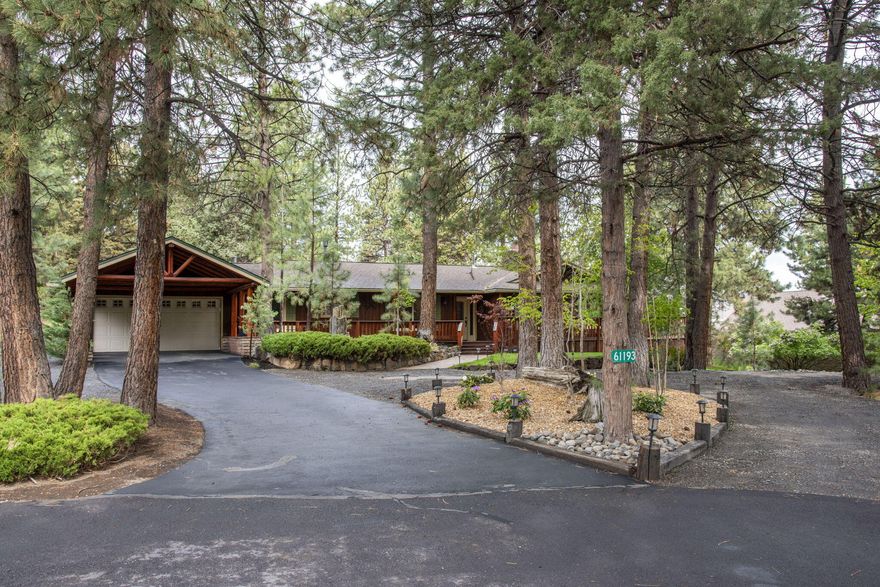 New Price - Motivated Sellers! This beautiful SW Bend single level beauty on .44 acre lot now has tastefully updated bathrooms and is ready to go! Tucked in a private oasis between Ponderosa pines, find this charming, peaceful cul-de-sac home with three bedrooms and three full baths, open plan kitchen, dining and family room, dedicated office, plus large living room with characterful touches throughout. Outdoor spaces to enjoy a starlit night include a private hot tub off
the primary suite, wrap around porch and beautiful treed lot with fire pit. Plenty of space for a large garden, or just watch the family of deer lounging under the juniper. Plus there's two cozy fireplaces (family room and living room), RV/trailer parking, a circular driveway and loads of storage in the home to round out all on offer. Possible RV garage/workshop/studio space in backyard - buyer to do due diligence with City of Bend.