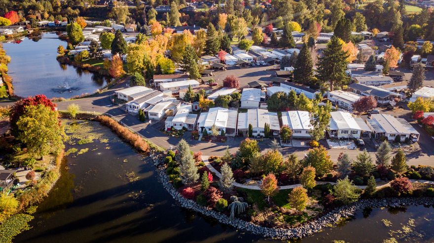 Check out this lakefront beauty in Roguelea Estates. Grants Pass' premier 55+ manufactured home community sitting right along the mighty Rogue River. Living in this community you will have access to a private park along the river where you can watch the famous jet boat races, enjoy river wildlife, and have picnics with your friends and family. The beautiful lake offers trout and bass catch and release fishing. The Clubhouse offers a variety of activities and can be reserved for private parties. About the home-This two bedroom, two full baths, spacious home is as cute as it is comfy! You will love the large primary bedroom and bathroom with double sinks and soaking tub. The covered porch is perfect for hanging out or enjoying the sunrise. The lot has a huge fenced back yard and the park does allow pets. Now is the time to make the move! Call to see this beauty today!