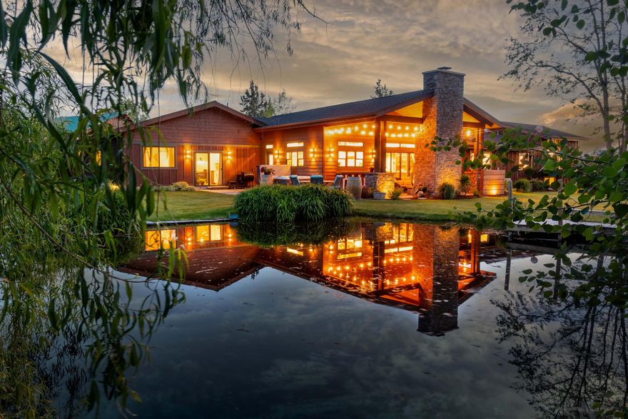 Discover peace, privacy, and panoramic Cascade Mountain views--where eagles soar, deer roam, and the city feels far away. Nestled on 4.23 acres—with 1.5 acres of COI irrigation, this fully renovated 5-bed, 3-bath home offers 3,653 sq. ft. of refined living space. The heart of the home is the sunshine streamed open-concept gourmet kitchen with high-end appliances, large pantry, and seamless flow to the covered patio and BBQ area. Ideal for multi-generational living or remote work with 2 living rooms, bonus room, and office. Relax on the wraparound deck, enjoy the fireplace by the pond, or explore the custom treehouse. The 30'x40' heated shop has an office, tack room, and trailer turnaround. The property includes a fenced garden, greenhouse, chicken coop, corral and paddock. Convenience and ease with an underground pressurized irrigation system in the front pasture and a second pond with in-ground irrigation for the back field. A rare blend of rural charm and luxury living—welcome home!