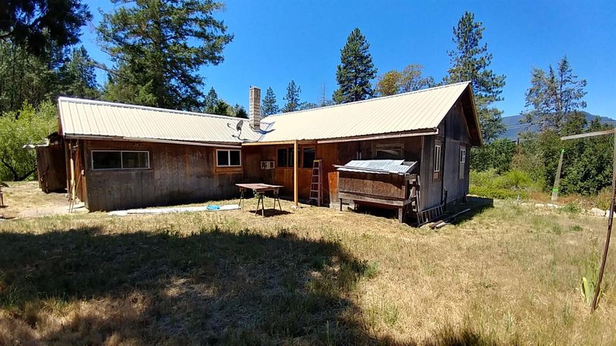 Just a few custom touches and you will have this one the way you want. Home was being updated and seller is ready to let someone else finish. Located on 6 Acres in Williams with barn and extra workshop or guest quarters. With garage and tack room. Most of the windows have been updated and a metal roof along with extra touches. New Septic tank being installed 8-25 - 8-29. If you're looking for country with space and extras this one could be the one for you! Serious buyers only. All information deemed accurate but not guaranteed and subject to change at any time.