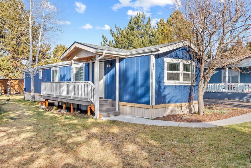 Welcome to this light, bright, open concept, mobile home located in the desirable, all-ages, Country Sunset community. Step inside to a thoughtfully designed interior featuring a seamless flow from the kitchen to the living room and hallway, all enhanced by stylish vinyl plank flooring. Additional updates include: an HVAC electrical system, designer floor vents, paint throughout - including the cabinets. The exterior has recently been upgraded with new front deck and back porch constructed with Trex decking. Rain gutters and downspouts, a new back door and an extended roofline over the front door and stairs add both practicality and curb appeal. A large storage shed is adjacent to covered carport. Conveniently located near Reed South.  Please do not disturb seller.