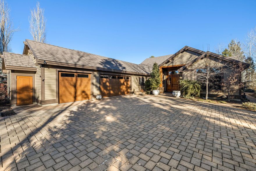 Single Level Broken Top custom home on private .45 acre property situated along the 9th fairway.  The curb appeal of the elegant paver drive & mature landscaping, sets the stage for what lies beyond.  Arranged on one level, the flowing floor plan is the ideal layout for day to day living & entertaining friends and family. The welcoming great room creates a comfortable space that transitions easily to the spacious dining area, chef's kitchen & garden view breakfast nook. The primary suite is in a separate wing from the two full-ensuite guest rooms & features private access to patio, as well as a cozy reading nook and gas fireplace. Outdoor entertaining is a dream on the large paver patio, a serene space that includes a fabulous Pergola enclosed outdoor kitchen with bar seating, granite counters, built-in gas grill, porch swing & solar powered louvered covering allowing you and your guests to enjoy sun or shade. There is also a huge 3 car garage w/ plenty of room for your outdoor gear.