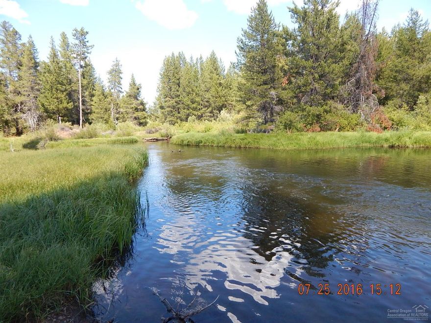 A river runs thru it! This wonderful parcel is 11.83 acres with Little Deschutes running thru it. Has several small ponds, a small creek and plenty of grassy areas along the river. Commercial building included, city is putting sewer line in to the property 2019.