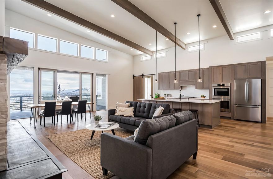 Brand new construction with BIG views in popular NW Bend. Enjoy main level living in this contemporary designed home. Master and two en suites plus an office, butlers' pantry and laundry room all on the main floor with nice separation of the master from the other bedrooms. The great room opens to an expansive trex deck to create a perfect spot for private outdoor living. Downstairs is two large bonus spaces, one that opens to another huge deck, another bedroom/full bathroom, and second utility room, making it a perfect candidate for separate living space. Be sure and watch the matterport 3-D tour for more details on the floor plan and finishes.