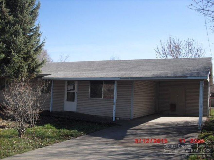 Cute single level home in downtown and close to medical and schools.Has fresh paint inside and all new appliances,vinyl siding and an attached carport plus a two car garage w/a shop area plus alley access in back with RV parking. Yard is landscaped with fruit trees and is fenced. Newer carpet & being sold as is.Extra storage room where furnace is for freezer or pantry. Well for watering yard. See attachment for PAS requirements and WFHM offer submittal information in MLS document section.