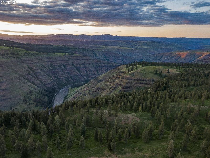 The Camp 9 Hunting Ranch is as rare and unique of a property that you will ever find. Located at the end of Day Ridge above the Grande Ronde River. Many say it's the neatest property they've ever seen. Lock the gates when you enter and leave the world behind with this extremely private setting. There's a large healthy Elk herd that produces mature bulls every year. Elk are so thick that sleeping during rut can be a challenge around the cabin area! Property qualifies for 5 landowner preference tags for elk (buyer to confirm with ODFW). This 9,100+ offers dense and mature timber, miles of creek and river frontage and nearly 900 areas of non-irrigated farmland. Views go for miles and you can even see Wallowa Mountains. The property is remote and takes well over an hour to get to Enterprise, OR, The drive is worth it. An opportunity to own a ranch such as this is truly rare. Do no let this opportunity pass by. Property to be shown to prequalified buyers only.
