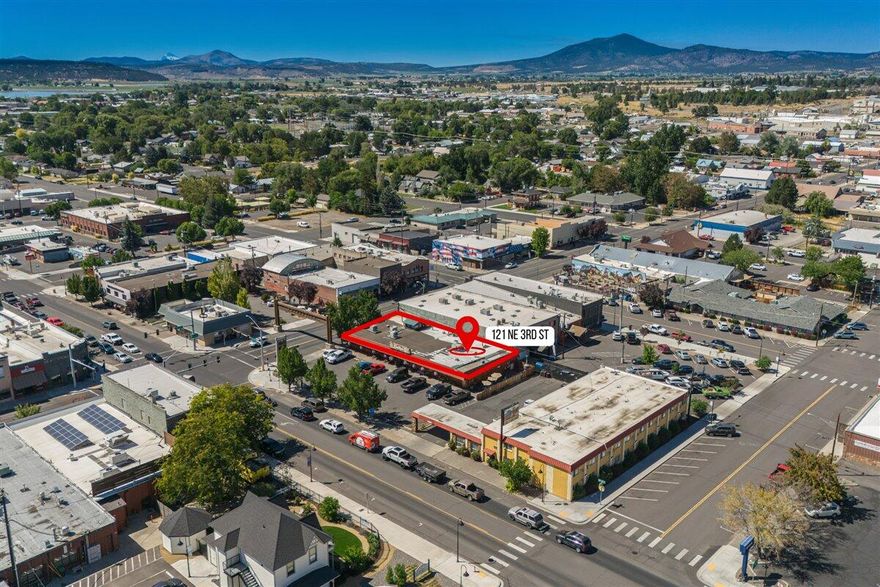 Prime downtown Prineville NNN investment opportunity! This 5,800 SF property, offered at $1,310,000 with a 7.15% CAP rate, is fully leased with a brand-new 5-year term beginning August 2025 and a 5-year renewal option. Enjoy 3% annual rent increases for built-in income growth. Situated on 0.33 acres with coveted C1 Central Commercial zoning, the building features a fully equipped commercial kitchen, full-service bar, and prime visibility in the city's vibrant core. Anchored by Crossroads BBQ Pit & Pub—a proven tenant and community favorite for over a decade—this property benefits from steady local and tourist traffic. Located adjacent to the newly renovated High Desert Inn with on-site parking, this stable, income-producing asset is set in one of Central Oregon's fastest-growing communities.