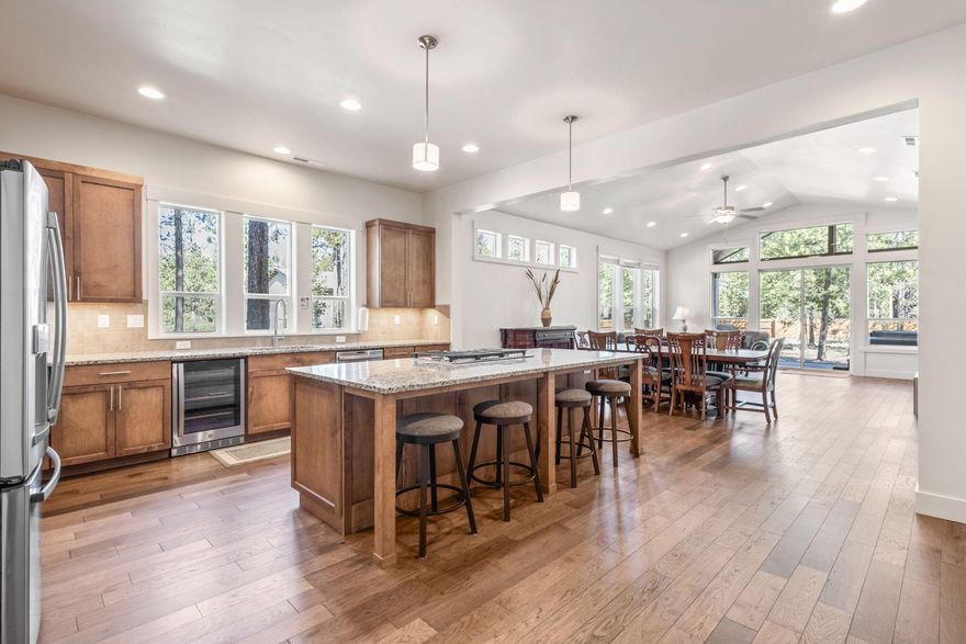 This stunning custom home, located minutes from Sunriver Resort and en route to Mt. Bachelor and the Cascade Lakes, is a must see! Nestled on a spacious, private, landscaped lot just ½ mile from the Deschutes River, it's the perfect retreat for adventure and relaxation. Designed with entertaining, family gatherings and income potential in mind, this 5-bedroom home features an open living concept, bonus room with a built in bar, chef's kitchen with upgraded appliances, 3-car garage and full RV hookups. The main-floor primary suite includes a spa-like en suite with a soaking tub, while expansive ceilings, oversized windows, and high-end finishes elevate the entire home. Relax and rejuvenate in the hot tub on the covered patio, where you're immersed in the beauty of nature. Added upgrades include a backup generator and whole-home water filtration system. Whether you're seeking a primary residence, vacation getaway, or str investment, this property truly embodies the Central Oregon Dream!