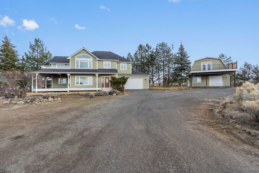 Cascade Mountain Range views, privacy, & unmatched versatility on 2.5 fully fenced acres—minutes from Bend in the coveted ''Golden Triangle'' of Bend/Tumalo. This exceptional estate offers rare multi-generational living & income potential, featuring a 2,599 sqft custom home with 3BD, 2.5BTH, vaulted ceilings, bonus loft, wood-burning stone fireplace, gas fireplace, & an upper deck with hot tub overlooking the mountain views. Primary suite boasts a spa-like bath with heated travertine floors, jetted tub, & walk-in tile shower. Fully permitted 2BD guest house with full kitchen, laundry, deck, & garage adds flexibility for guests, extended family, or rental use. Hobbyists will love the 30'x40' shop with 200-amp service, 220V hookup, & bathroom. Property includes a greenhouse, irrigated garden with deer fencing, chicken coop, wood storage, & is wired for a backup generator. All buildings painted in 2024. A rare opportunity in Central Oregon - offered at an exceptional value!