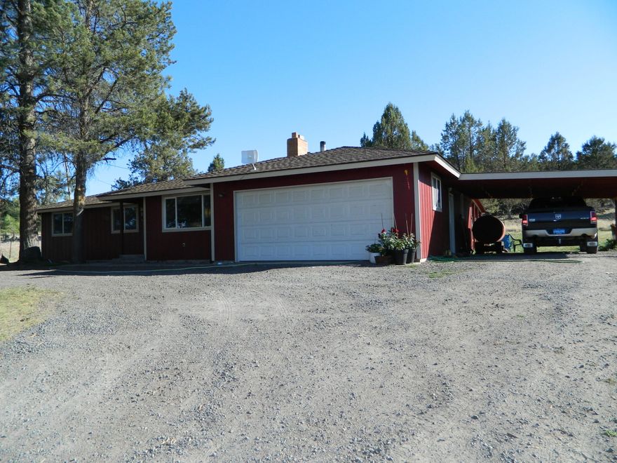 Hard to find home on acreage. This 3 bed 2 bath home is on 6.23 acres just outside of Dairy. It has a view that overlooks the farm grounds below. There is a living and family room, 2 car attached garage and carport