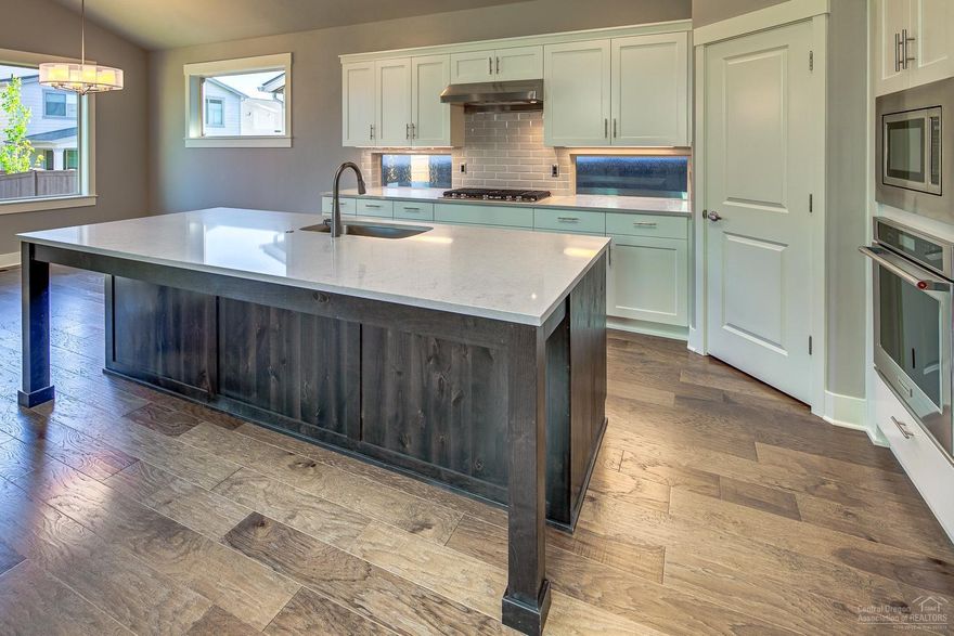 Stunning Single level home in Bend OR from quality builder - Pahlisch Homes! Open great room with chef's kitchen, walk in pantry, built in KitchenAid appliances, Quartz counters, hardwood flooring. Master features a tile shower, soaker tub & large walk-in closet. Vaulted ceilings in great room & kitchen, skylights, and huge mud/laundry room! Double vanity sinks in both full bathrooms.**Construction on 15th Closures, Use Knott Road and 15th South of Bridges to access** Under construction, photos are of a similar home, specs will vary. Fall 2019 completion.