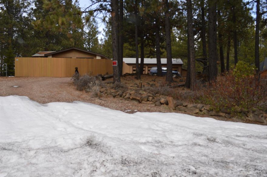 Don't miss your chance at this great little fixer! Good bones & you can't pass up this amazing large corner lot. Beautiful natural landscape for easy maintenance. Fenced area for pets/kids. HUGE triple garage w/ storage & shop areas, plus additional carport. Separate large metal storage building & a wood shed. Room for RV & toys. Great value with irreplaceable structures at this price & tons of room for cosmetic improvements to quickly boost your equity! Motivated seller, don't waste time-will go fast!