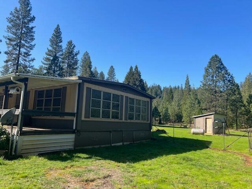 LARGE PRICE REDUCTION$$$ Property is back on the market for no fault of property.  Good Water BAN and Septic tests on file. This lovely level property is ready for you to build your Oregon dreams.  There is a nice mix of trees, a shop/garage and an 1973 double wide MFH with a 2 room add on.