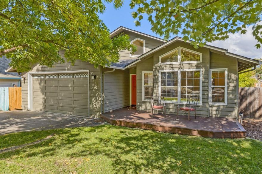 Enjoy the stunning updates in this single level, light filled home. From the time you enter to the time you step out back, the work is done. Front deck has been recently stained. Step inside & enjoy the large front windows & architectural details found in the vaulted ceilings. Next you'll find solid hardwood floors throughout most of the home & warm earth tone interior paints. Kitchen is complete with granite countertops, updated rich wood cabinets & a gas range in the island facing the open family & dining areas. out back you'll find a second newly stained deck, raised garden beds complete with a vegetable garden and raspberry & blueberry plants. You'll also find a newer roof & furnace. Need a third bedroom? The family room was once the third bedroom and can easily be converted back! All this less than 1.5 almost level miles to Downtown Ashland and Lithia Park.