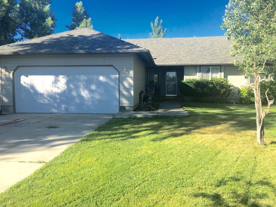 Huge .27 acre lot with old growth trees and landscaped like a park! Must see the back yard on this one!! Located in established neighborhood in a cul-de-sac. Fenced backyard with covered deck. Open floor plan, dining area, vaulted ceilings, 3 bedrooms, 2 full bathrooms. Large master! Woodstove, Recently updated second bathroom. Great location!! Must see!