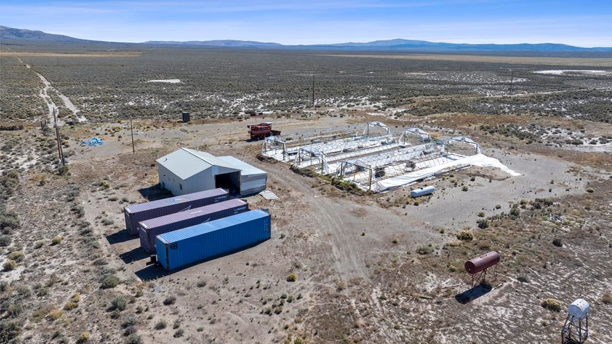 An exceptional farming opportunity with over 1,000 acres of farmland and over 500 acres of valuable water rights. The property includes a one-bedroom, one-bath building with electric heat and an insta-hot water heater, a three-sided storage shed, and three greenhouse frames with propane heating units. With a domestic well and two irrigation wells, this property is well-equipped for large-scale farming, ranching, or greenhouse operations. More photos coming soon.