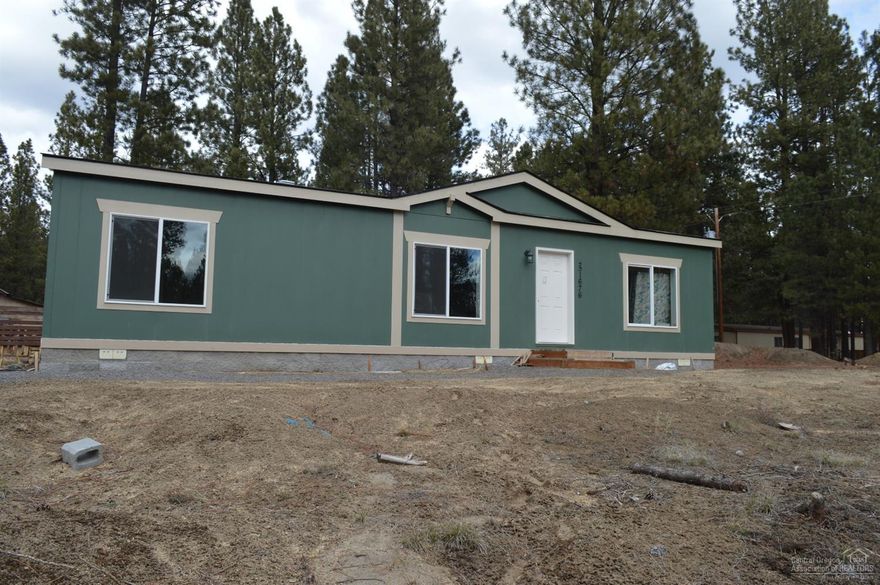 Beautiful almost new home with a lot of character and open floor plan. Located just a block off paved road, close to the Little Deschutes River, home sits towards the back corner of property giving you lots of privacy to the front of the home. Master bedroom separation with beautiful master bath and huge walk in closet. Home lives larger than square feet would make you think.