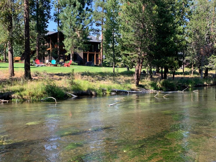 Riverfront Luxury calls you! Main home is 3276 sq. ft: detached accessory building is 1508 sq. ft. Comes fully furnished!
Perched on a beautifully landscaped acre w/ 148 feet of accessible river-frontage, this exceptional setting is not to be missed! Spend hours on the Fall River fishing, enjoying the peaceful scenery & cool mountain air. Enjoy an open concept living area, two primary suites, stunning primary bath remodel and custom closets throughout. Newly constructed, detached accessory building with 2 car garage, finished hobby room, bathroom & wet bar upstairs. There is plentiful RV & boat parking, you can easily store all of your Central Oregon toys and tools. Fall River Estates is a peaceful, serene and incredibly private community situated 11 miles from Sunriver, surrounded by national forest. It is known for pristine, crystal clear waters and an abundance of fish. Enjoy this world class location in a one of a kind home designed by Sun Valley Idaho architect Darryl C McMilllen.