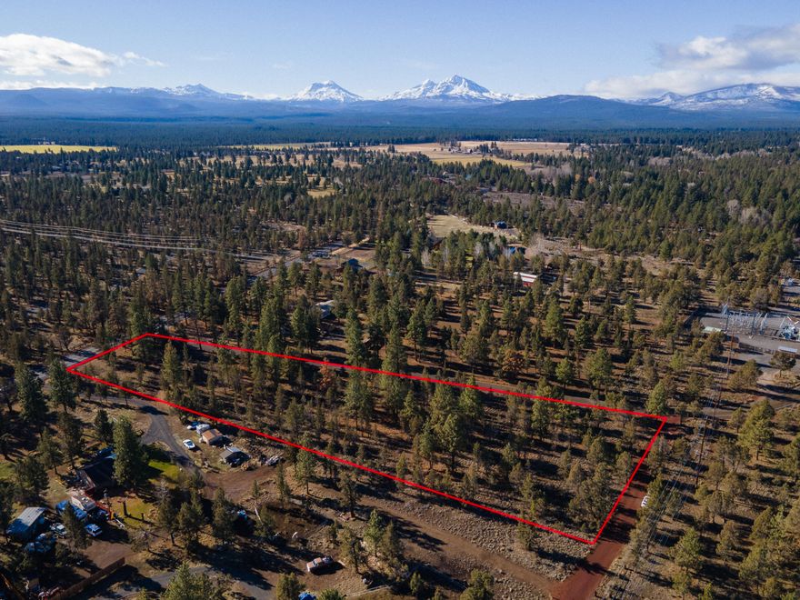 Enjoy rural living without all the work on this rare small acreage with mountain views and extremely close proximity to downtown Sisters! This beautifully treed 3 acre parcel fronts HWY 126, with the larger section of the lot being set back further from HWY 126 and trees blocking views of the road. This lot is the perfect place to build your home and have plenty of room for a shop, pasture, and all of your toys. CUP will be needed to build
