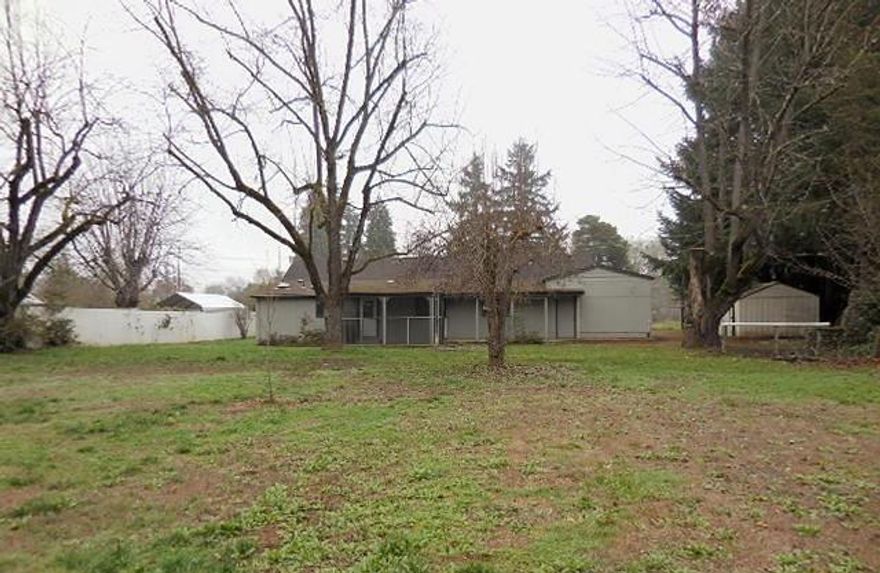 Quaint two bedroom, two bathroom home on almost a half-acre in scenic Grants Pass. Interior has nice-sized kitchen and jetted soaking tub in bathroom, while the huge yard has mature trees and stone outdoor grill. Attached garage with lots of storage and built-in shelving.