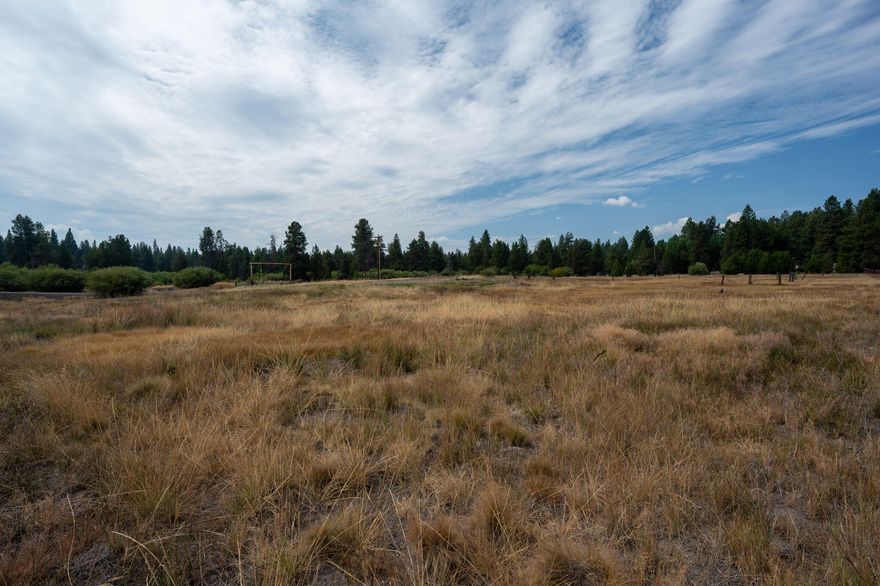 Beautiful 1/3 acre parcel ready for your dream home! Easy access and so many possibilities!  This coveted corner lot near the beautiful Deschutes River. With river access just across the street! 
This lot is private and full of potential. Owners in the area have created parklike settings and this one will be amazing with your vision! Close to the highway 97 corridor, local snowpark nearby and just off a beautiful Oregon Scenic Byway, you can enjoy a full time residence, part time vacation home or even use as a recreational property with full hook ups! Your possibilities could be endless here. Buyer to do all due diligence on land use approvals. Owner carry is not an option